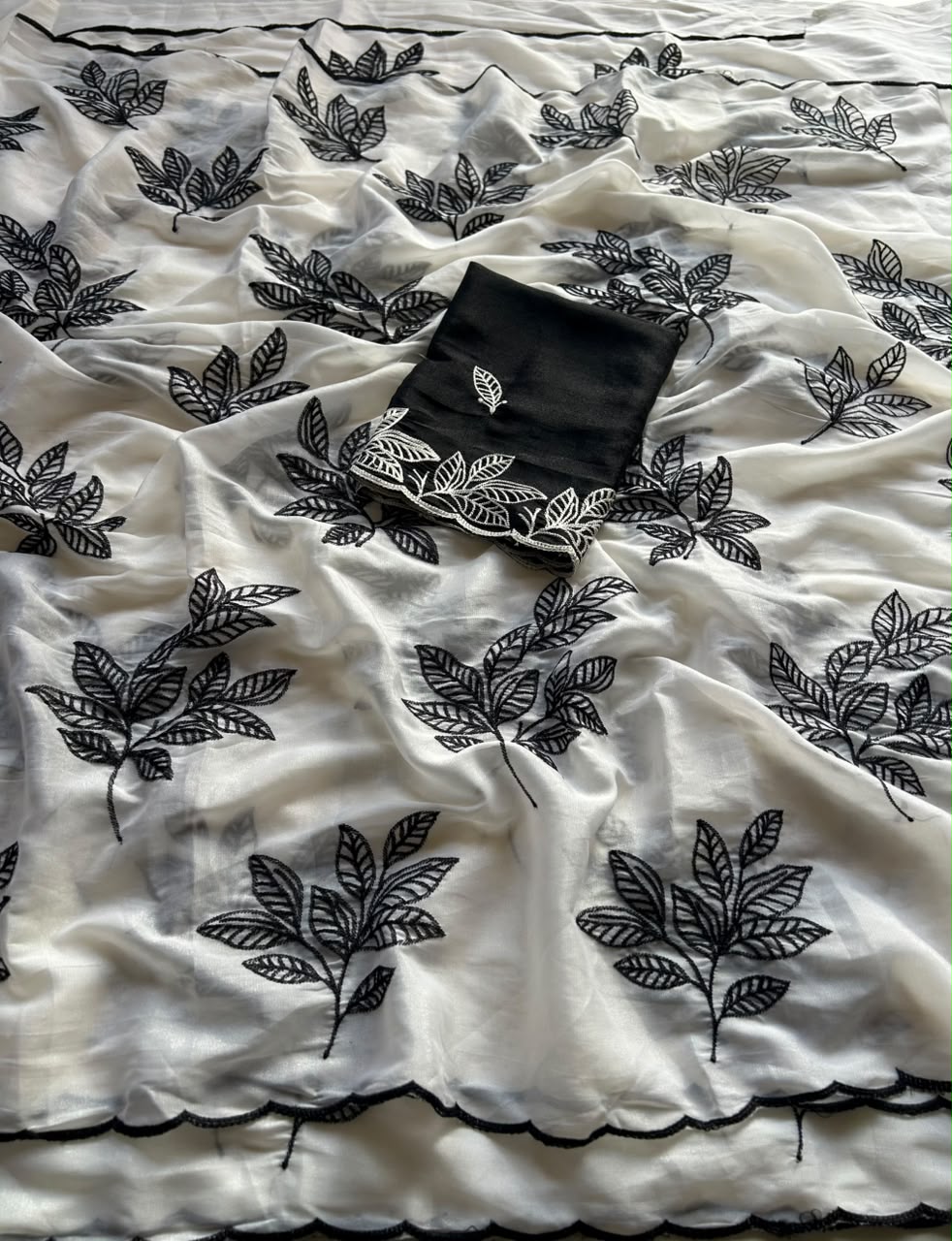 Chinnon silk saree with embroidery scalloped cut work border