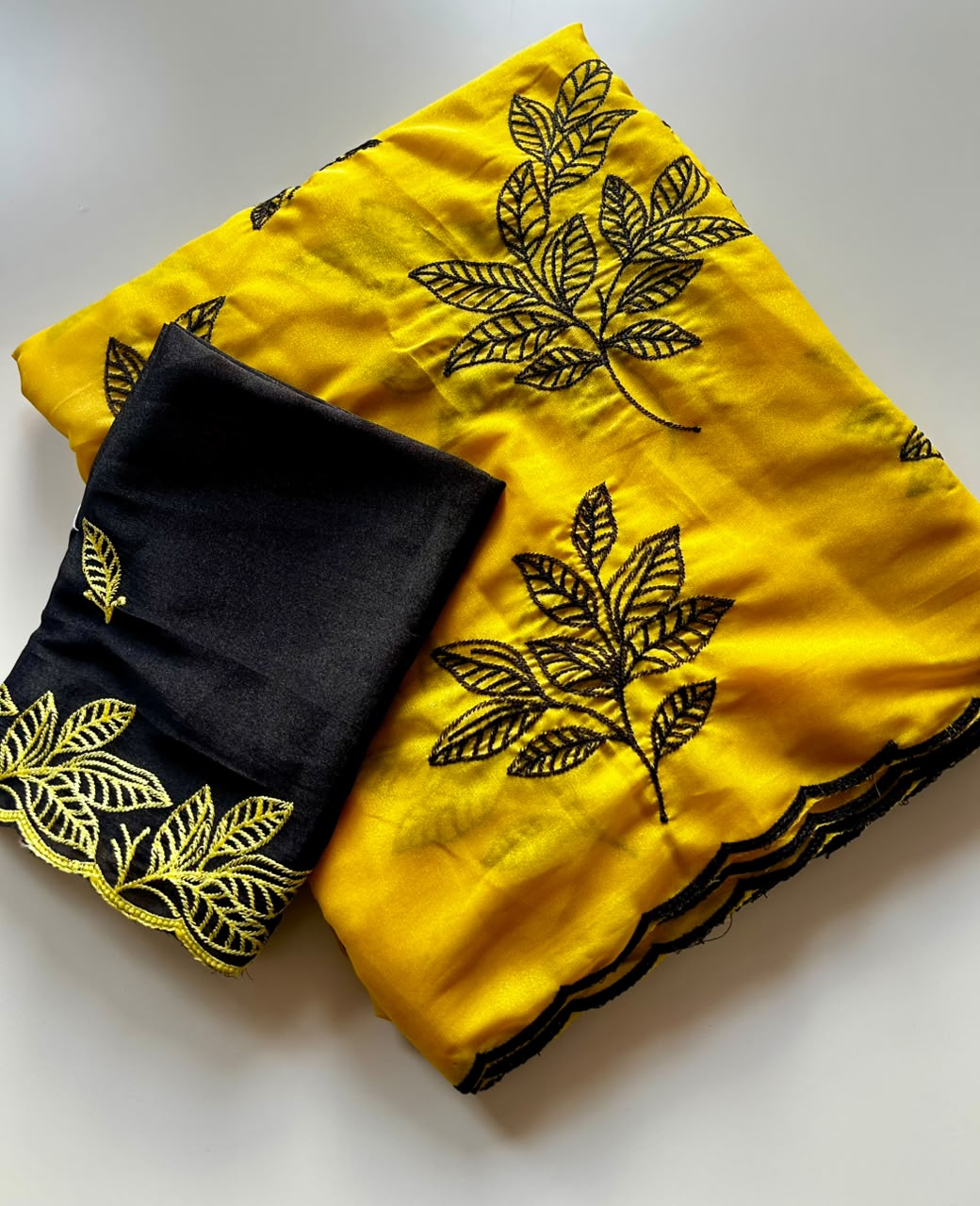 Chinnon silk saree with embroidery scalloped cut work border