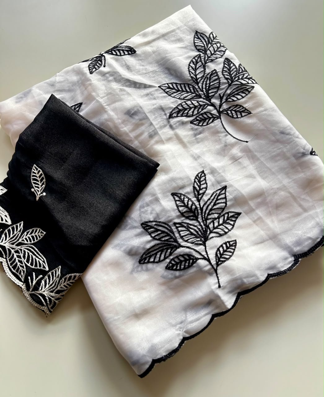 Chinnon silk saree with embroidery scalloped cut work border