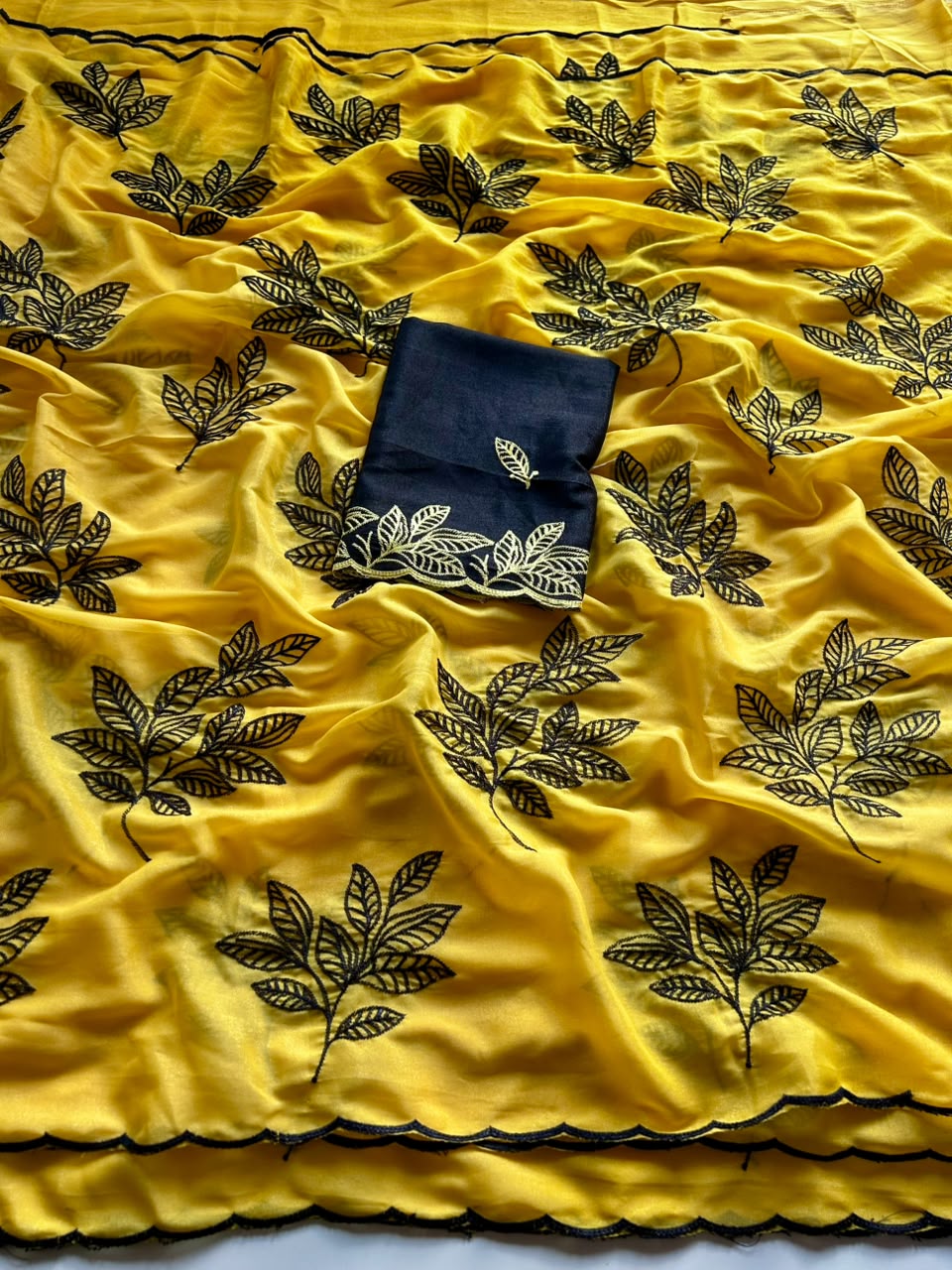 Chinnon silk saree with embroidery scalloped cut work border